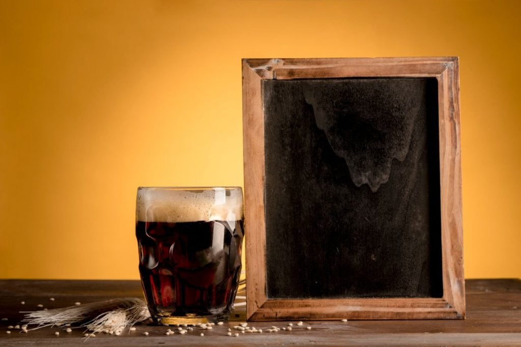 glass beer putting blackboard wooden table 1024x682