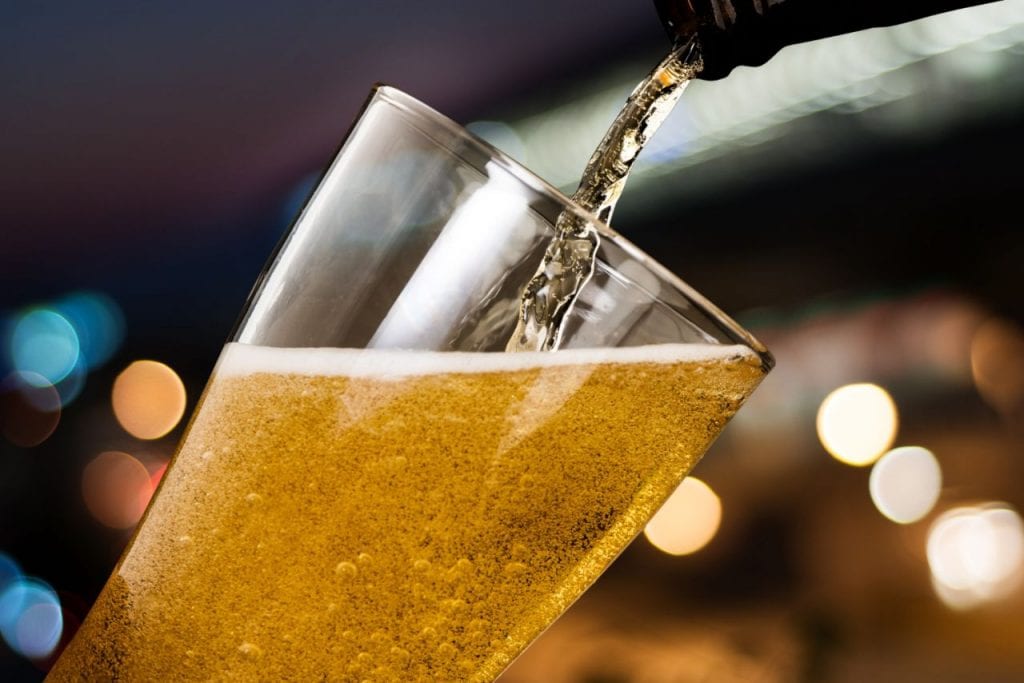 motion beer pouring from bottle into glass 1024x683