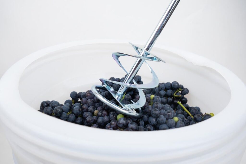 whipping grapes with mixer barrel process making homemade wine